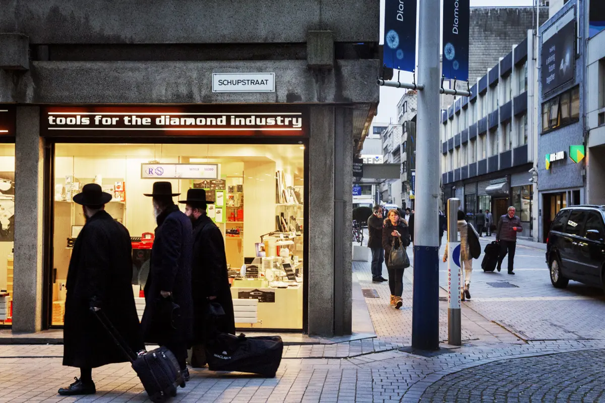 Street scene in Antwerp's diamond district featuring traditional diamond traders and a specialized tools shop